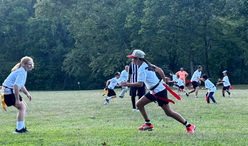 Kids sprinting during flag football