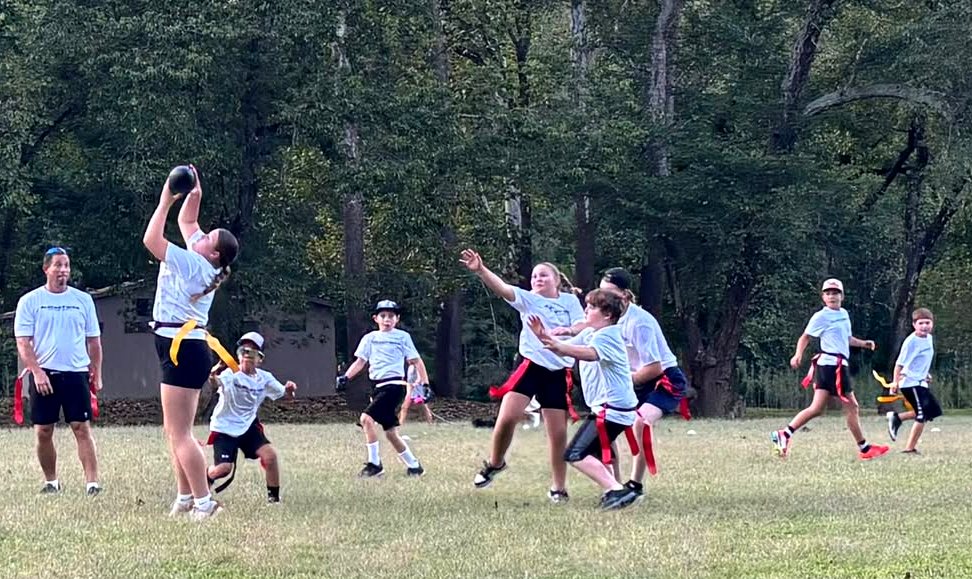 A young player throwing during flag football